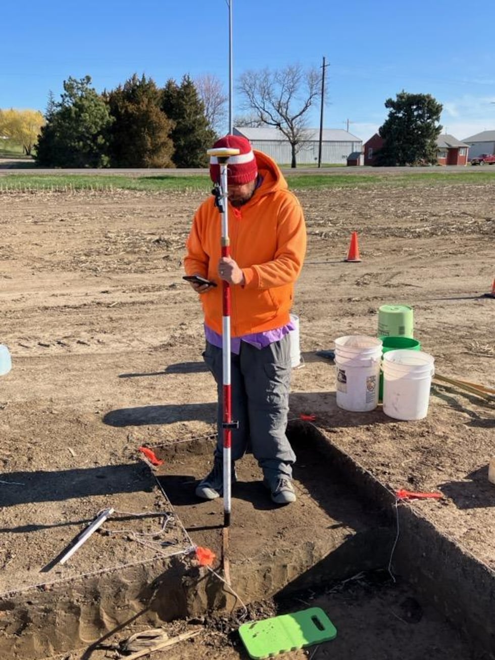 Project lead, NSHS archeologist Nolan Johnson uses GPS for coordinate plotting of digging area...