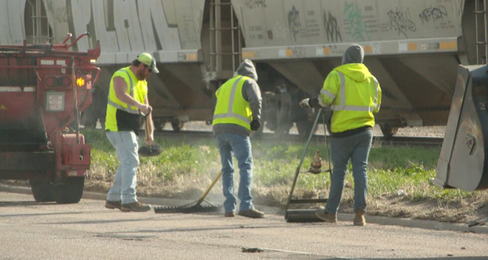Patching Crew Sioux City’s unsung heroes: Public works crew patching Floyd Blvd potholes