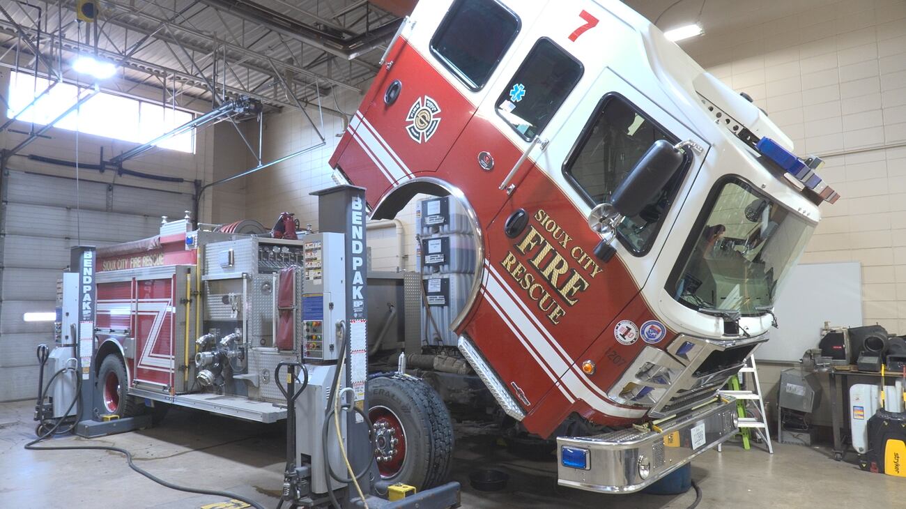 Fire Mechanic Under the fire engine with Sioux City Fire Rescue’s only mechanic